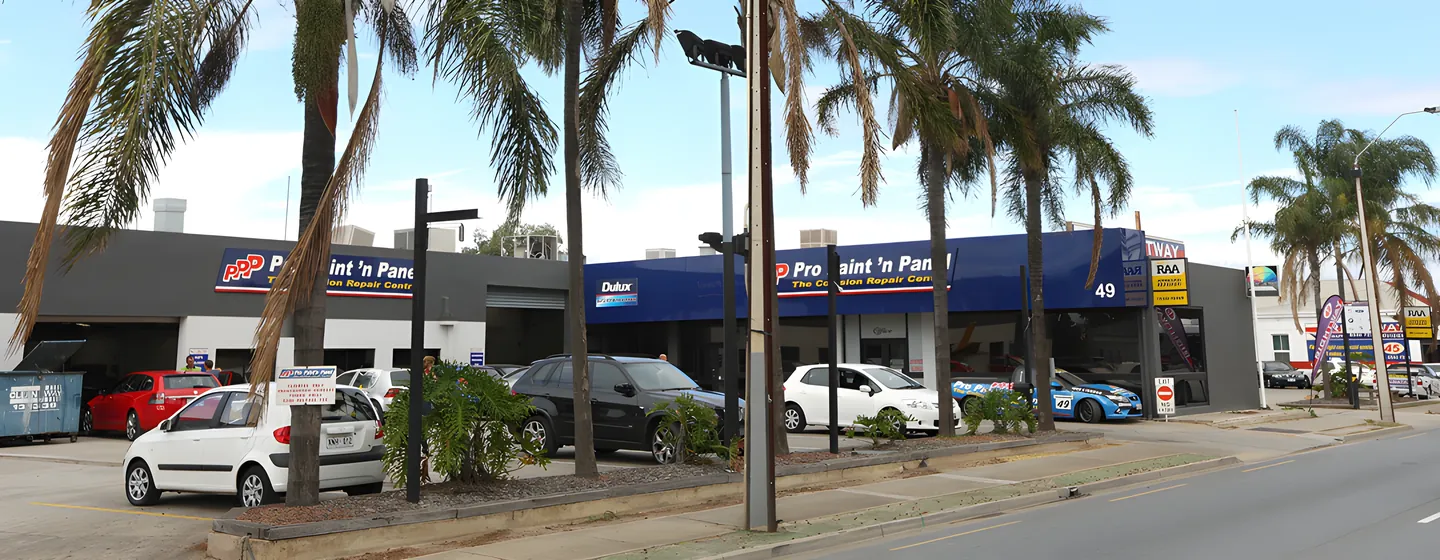 The Pro Paint 'n Panel workshop on South Road, Hindmarsh, blue signage running the length of the frontage.